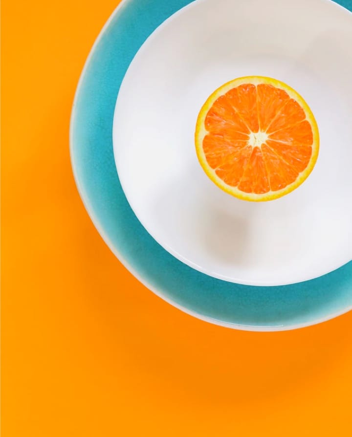 an orange on a plate
